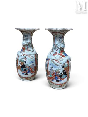 pair of chinese vases with oriental designs on them on a white background