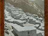 a picture of a picture of a village in the mountains