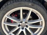 a close up of a car ' s tire on the road