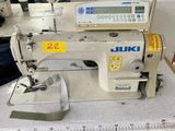an image of a sewing machine sitting on top of a table