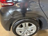 a close up of a car ' s tire on display in a showroom