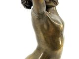 bronze statue of a woman holding a bowl on her head