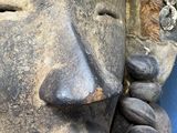 a statue of a person with a necklace on it ' s neck
