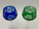 pair of cut glass wine goblets with blue and green designs