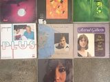 various album covers on the floor of a room