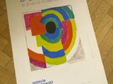 a poster on the floor with a picture of a colorful object