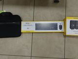 a laptop and a bag on the floor next to each other