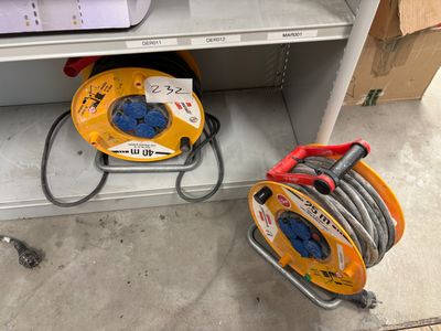 two hoses that are sitting on a shelf