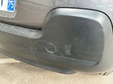 a close up of a car ' s bumper with a number plate on it