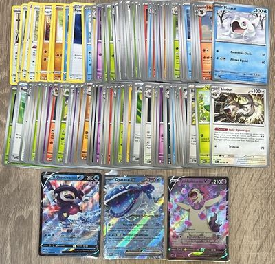 beaucoup de cartes pokemon sur la table