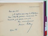 an old book with a handwritten letter on it