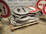 a lot of signs that are sitting on a pallet