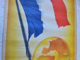 posters on the wall of a building with a french flag on it