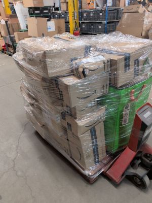 a large stack of boxes sitting on a pallet in a warehouse