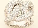 an image of a white gold and diamond ring on a white background