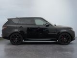 a picture of a black range rover parked in a garage