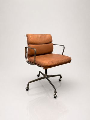 an image of an office chair with a brown leather upholstered seat