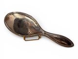an image of a hair brush with a metal handle on a white background