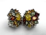 pair of multicolored stone stud earrings on a white surface