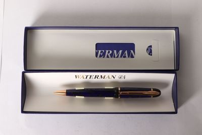 a pen that is in a box on a table