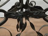 a close up of a metal object on a wooden floor
