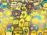 a painting of a group of people on a yellow wall