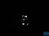 an image of a diamond in the dark on a black surface