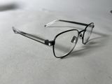 a pair of glasses sitting on a white surface