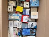a cardboard box filled with many different types of electronic devices