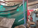 an image of a machine that is working on a piece of metal