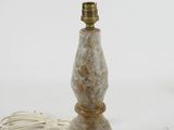 marbled lamp with a cord attached to it on a white surface