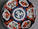 two plates with different designs on them on a table