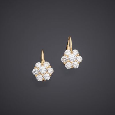 a pair of diamond and gold earrings