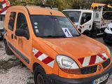 an orange van that is parked in a parking lot