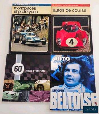 three books on a table with a picture of a race car and a number of other books
