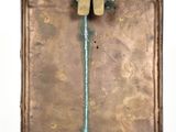 a metal object with a hammer sticking out of it
