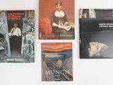 several books on a white table with a white background