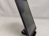 a close up of a tablet on a stand on a white surface