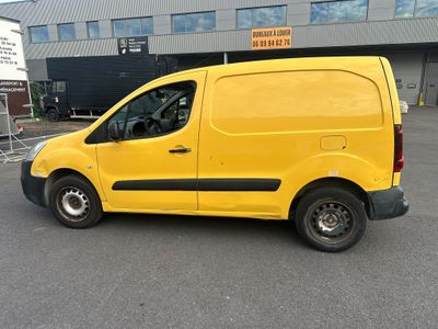 the yellow van is parked in the parking lot outside of the building