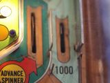 a close up of a pinball machine with buttons on it
