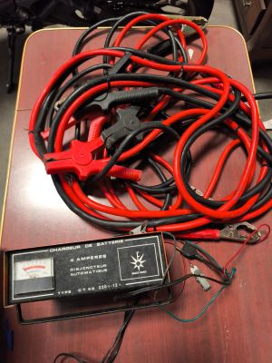 a bunch of wires and a charger on a table