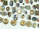many different types of badges on a white surface