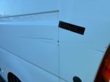 a white van that has a sticker on the side of it