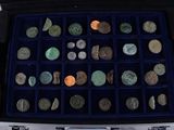 a case full of different types of coins in it