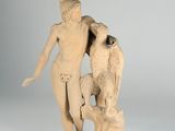 statue of a woman and a bird on a pedestal