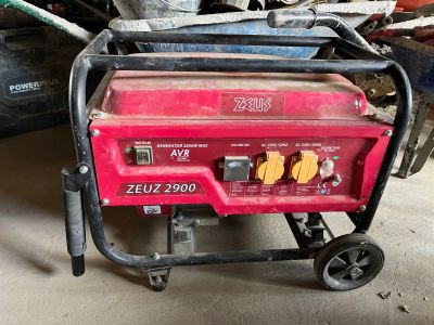 a small generator that is sitting in the garage