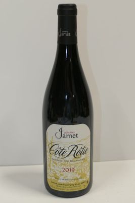 a bottle of wine that is sitting on a table