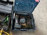 a tool box with tools in it sitting on the ground