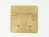 a gold plate on a white surface with a white background