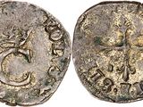 a silver coin with an image of a man on it
